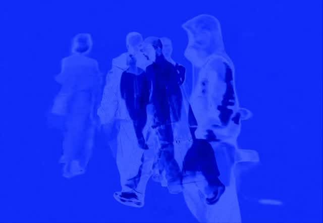 Figures walking, washed in electric blue