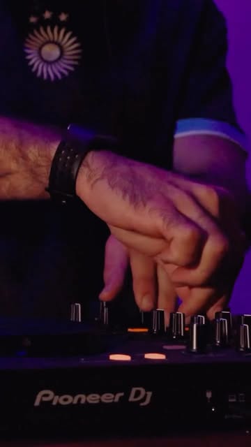 DJ hands on a Pioneer controller