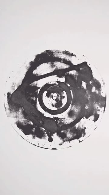 Ink-stained vinyl record on white